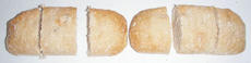 Each loaf is cut into three equal pieces and the six pieces arranged as three groups of two.