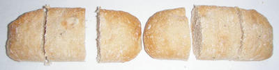 Each loaf is cut into three equal pieces and the six pieces arranged as three groups of two.